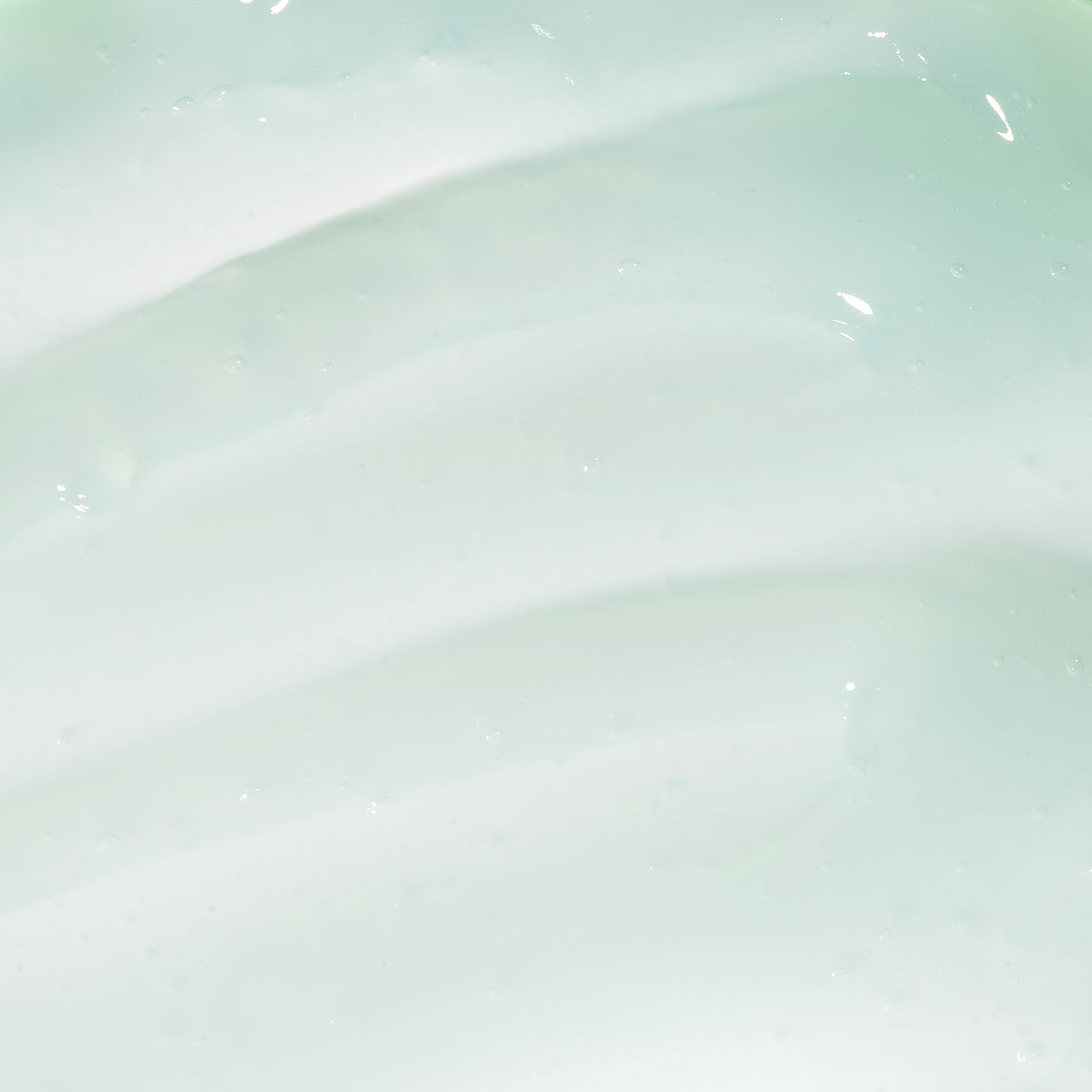 A close up of Midnight Radiance Mask light texture with light green colour with salicylic acid and sand lily extract.
